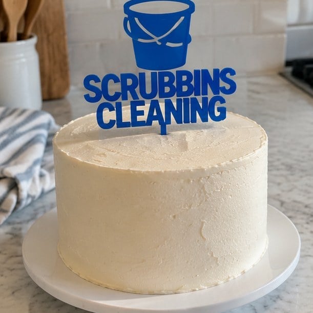 Customer photo of a custom logo cake topper